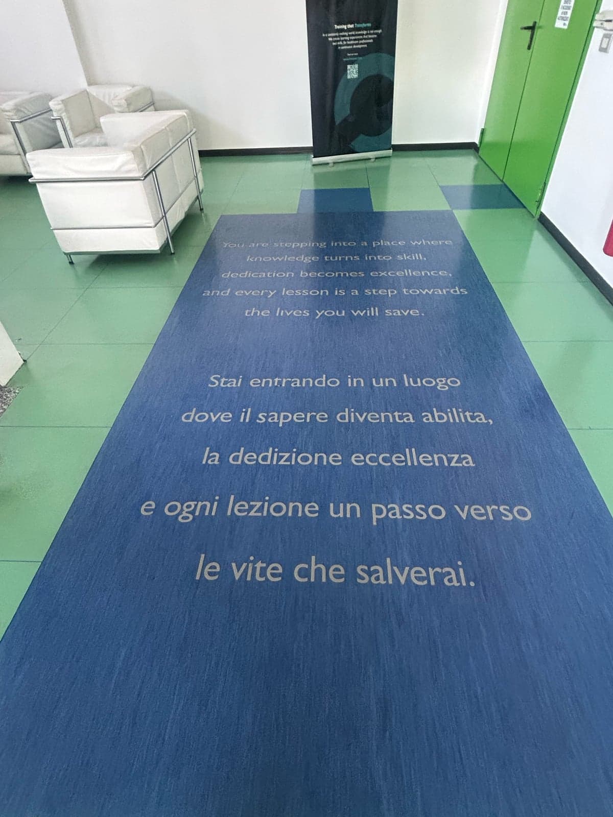 AnatomX entrance hall with a motto printed on the floor